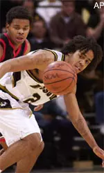 Texas Tech's Andre Emmett, left, and Missouri's Wesley Stokes, right, fight for a loose ball.
