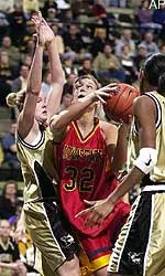 Iowa State's Angie Welle (32) splits Missouri's Evan Unrau, left, and Amanda Lassiter, right, as she heads to the basket Wednesday.