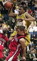 Missouri's Arthur Johnson is fouled by Nebraska's Cary Cochran during the second half of the Tigers' 68-66 victory Saturday evening.