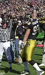 Missouri's Ben Fredrickson celebrates after his 8-yard touchdown grab against Texas.