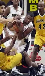 Najeeb Echols wrestles the ball away from Grambling State's Darius Whiteside in their game Saturday.