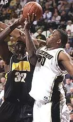 Missouri's Arthur Johnson, right, tries to stop Reggie Evans from shooting during the first half.