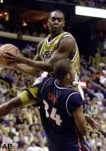 Missouri's Clarence Gilbert draws a blocking foul from Illinois' Brian Cook during the first half of their annual Braggin' Rights game Saturday.