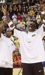 MU seniors Johnnie Parker and Tajudeen Soyoye wave to the crowd during the Saturday's Senior Day Festivities.