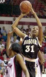 Missouri's Wannette Smith (31) pushes past Georgia's Tiaunna Briggans (24) during their 78-65 victory over Georgia in the second round of the NCAA East Regionals.