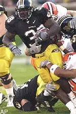 Missouri running back Zack Abron tries to break free against Bowling Green tacklers during the first half.