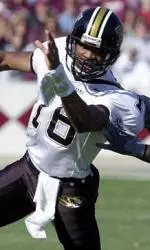Missouri quarterback Brad Smith scrambles as Texas A&M linebacker Jesse Hunnicutt pursues.