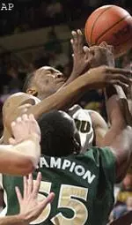 Arthur Johnson, shown here battling for a rebound, scored a career-high 24 points, Monday.