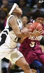 Oklahoma's Rosalind Ross fights for a loose ball against Missouri's Angie Carter during the first half.