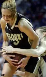 Lauren Podratz is fouled by Kansas State's Brie Madden during the first half Wednesday.