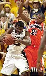Missouri's Rickey Paulding battles Virginia's Roger Mason during the first half of their game Sunday.