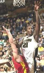 Kareem Rush tosses in a shot over Iowa State's Shane Power during the second half of Missouri's 76-73 victory.