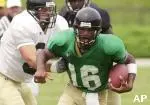 QB Brad Smith eludes Phil Pitts during Saturday's scrimmage at Faurot Field
