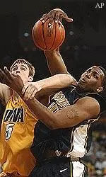 Missouri center Arthur Johnson fights for a rebound in the second quarter against Iowa.