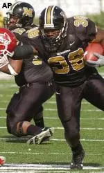 Zack Abron breaks Missouri's career rushing record, eclipsing Brock Olivo's mark of 3,028 yards set in 1997.
