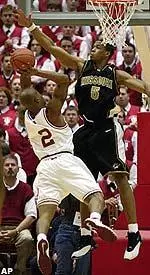 Travon Bryant attempts to block the shot of Indiana's Patrick Ewing Jr. during the first half in Bloomington Saturday.