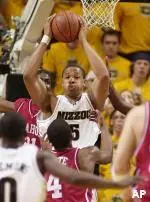 Travon Bryant pulls down a rebound in front of Oklahoma's Jabahri Brown, Wednesday night.