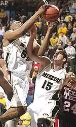 Arthur Johnson, shown grabbing a rebound in front of teammate Josh Kroenke, had 23 points and 13 rebounds against Texas Tech, Sunday.
