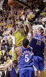 Ricky Clemons shoots over Kansas' Keith Langford and Kirk Hinrich during the second half.