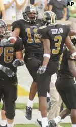 Sean Coffey celebrates with teammates Darius Outlaw after he caught a 4-yard touchdown pass.