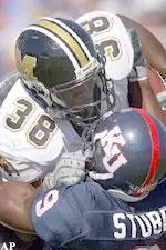 Zack Abron collides with Kansas safety Tony Stubbs during the first half.