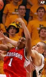 Linas Kleiza battles Nebraska's Jason Dourisseau for a rebound during the second half.