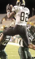 Missouri tight end Martin Rucker makes a touchdown reception between Baylor defenders Maurice Lane and Willie Andrews during the second quarter. (AP Photo/Waco Tribune-Herald, Duane A. Laverty)