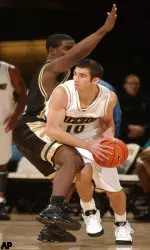 Missouri's Spencer Laurie, right, looks for help as he is guarded by Oakland's Demarcus Ishmeal, Saturday, Dec. 4, 2004, during the second half of Missouri's 70-61 win in Columbia, Mo.