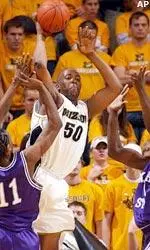 Senior Arthur Johnson passes out of a double team against Kansas State.