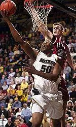 Arthur Johnson lays in a basket in front of UNLV's Louis Amundson in the second half.
