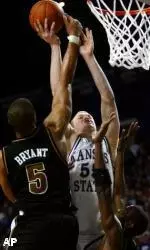 Travon Bryant rejects a layup attempt by Kansas State's Tyler Hughes in the second half.