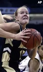 Evan Unrau battles past Kansas State defenders.