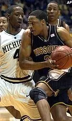 Guard Jason Conley drives against a Michigan defender during the first half.