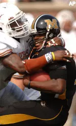 Missouri quarterback Brad Smith, right, is hit hard by Texas' Aaron Harris, left, during the first half. (AP Photo/L.G. Patterson)