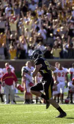 Adam Crossett runs off the field after he kicked the game-winning field goal in Missouri's 27-24 overtime victory over Iowa State.