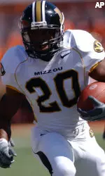 Missouri's Marcus Woods makes his way through Oklahoma State's Darnell Smith and Phinney Troy, left, during the first half. (AP Photo/Brody Schmidt)