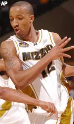 Furman's Jadee Jones, left, knocks the ball out of the hands of Missouri's Jason Horton. (AP Photo/L.G. Patterson)