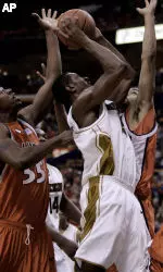 Marshall Brown attempts a shot against Illinois Shaun Pruitt (55) Brian Randle, James Augustine (40) and Dee Brown (11) during the second half. AP Photo/James A. Finley)