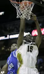 Marshall Brown (15) is fouled by Eastern Illinois center George Tandy. (AP Photo)