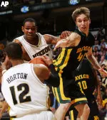 Kalen Grimes pushes off Baylor's Mark Shepherd as teammate Jason Horton pulls down the rebound.