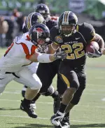 Clinton Polk (22) breaks a tackle against Oregon State linebacker Bryant Cornell (41). (AP Photo)
