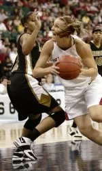 Oklahoma guard Laura Andrews (11) looks for a shot against Missouri guard Alyssa Hollins during the first half their Big 12 Women's Basketball Championship tournament game Thursday, March 9, 2006, in Dallas. (AP Photo/Tim Sharp)