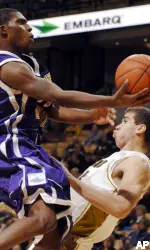 Western Illiniois' James Washington is fouled by  Justin Safford. (AP Photo/L.G. Patterson)