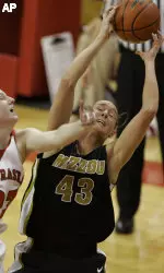 Carlynn Savant competes for a rebound in the first half.