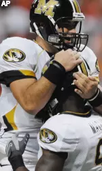 Missouri quarterback Chase Daniel celebrates with teammate Jeremy Maclin after Maclin scored a touchdown on a reception. (AP Photo/L.G. Patterson)