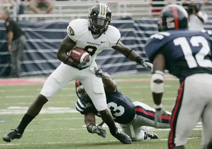 Missouri wide receiver Jeremy Maclin (9) fights off a tackle by Mississippi defensive back Jamarca Sanford (13)
