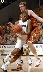 Missouri's Stefhon Hannah drives around Texas' Connor Atchley during the second half. (AP Photo/L.G. Patterson)