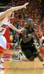 Keon Lawrence drives to the basket during the first half.