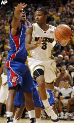 Missouri's Stefhon Hannah drives around Kansas' Darrell Arthur during the second half (AP Photo)