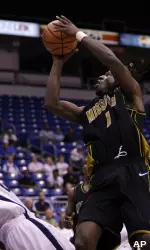 DeMarre Carroll shoots over Xavier's B.J. Raymond during the first half at the Puerto Rico Tip-Off tournament in San Juan. (AP Photo/Andres Leighton)